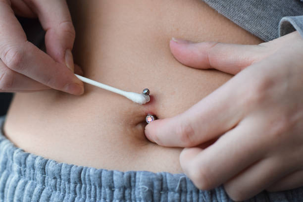 Bloody Tissue Emergence: Navigating Belly Button Piercing Complications for Safe Healing 2024